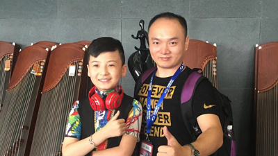 校长林羽龙与童星武东博合影